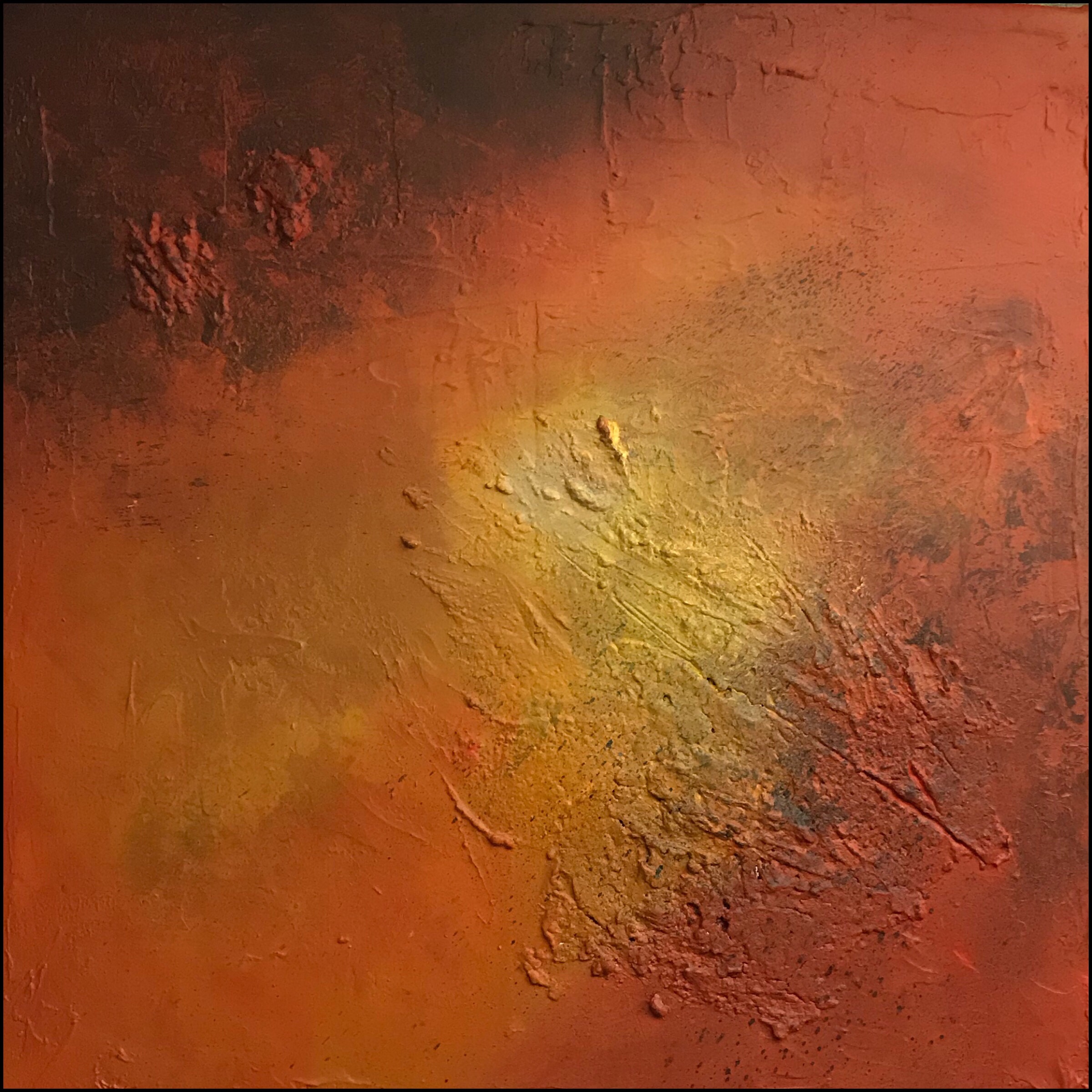 Textured abstract painting in warm colors