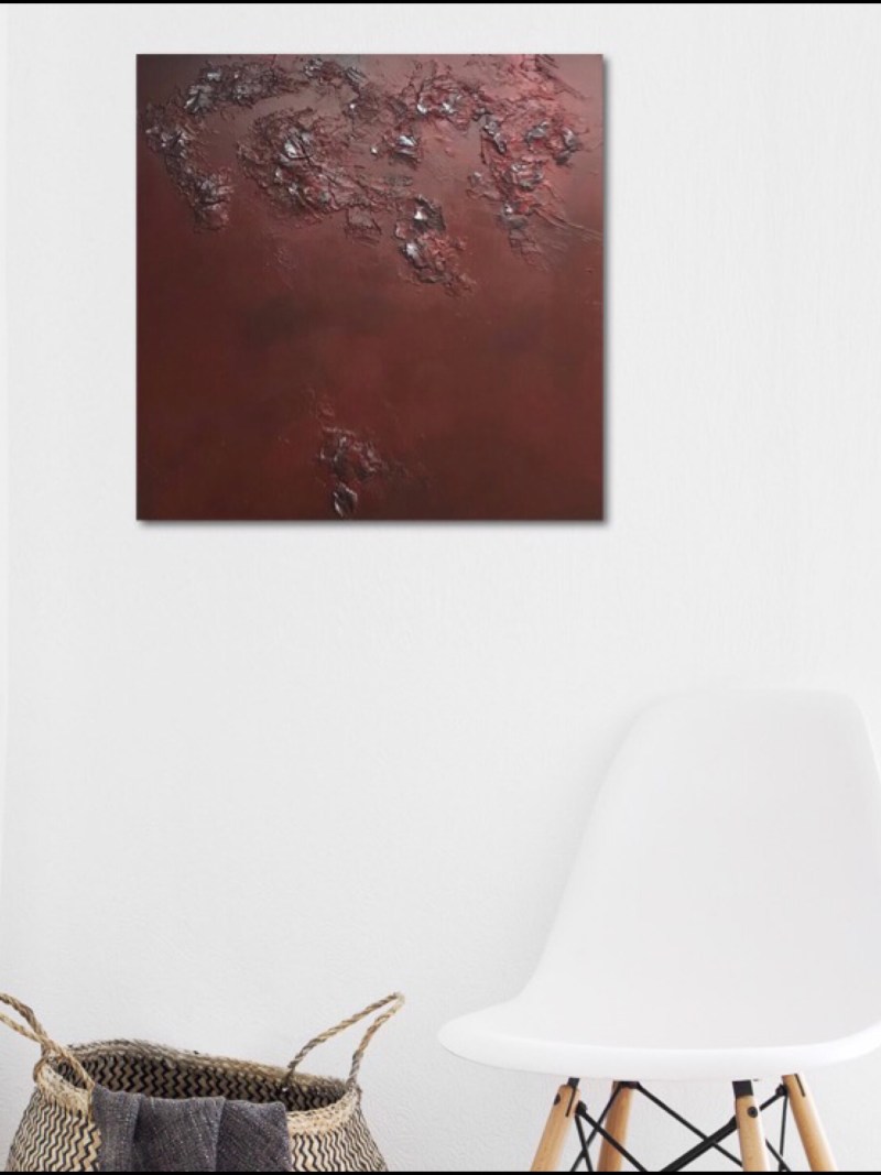 Textured abstract painting in red and a touch of silver